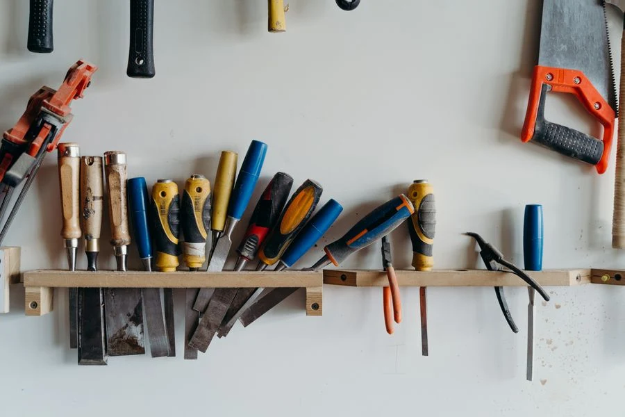 French cleat wall with tool holders in a shed