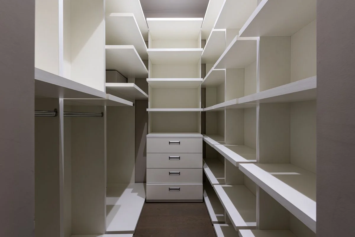 Drawer tower unit inside a closet for folded clothes