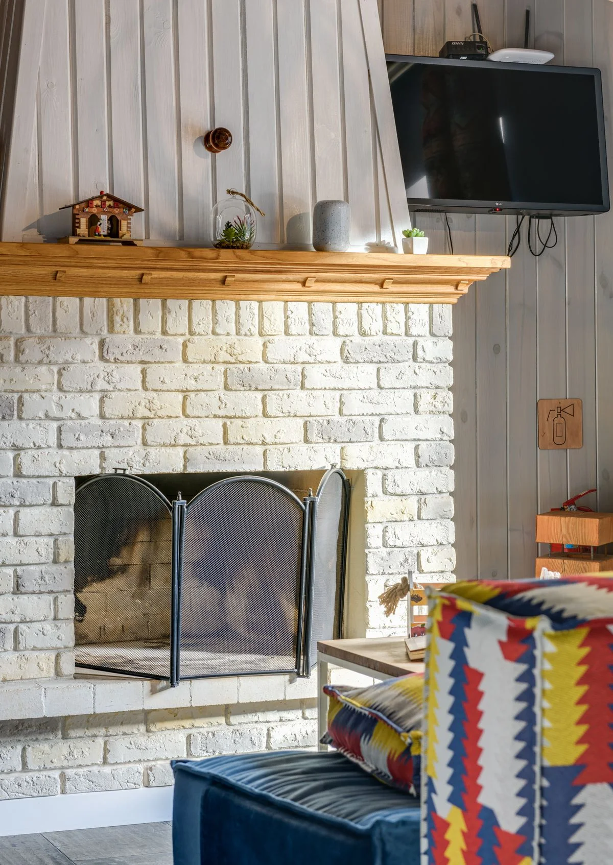 Brick fireplace in a farmhouse living room