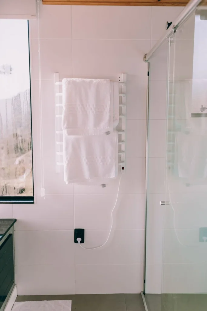 Heated towel rail with warm towels in a bathroom