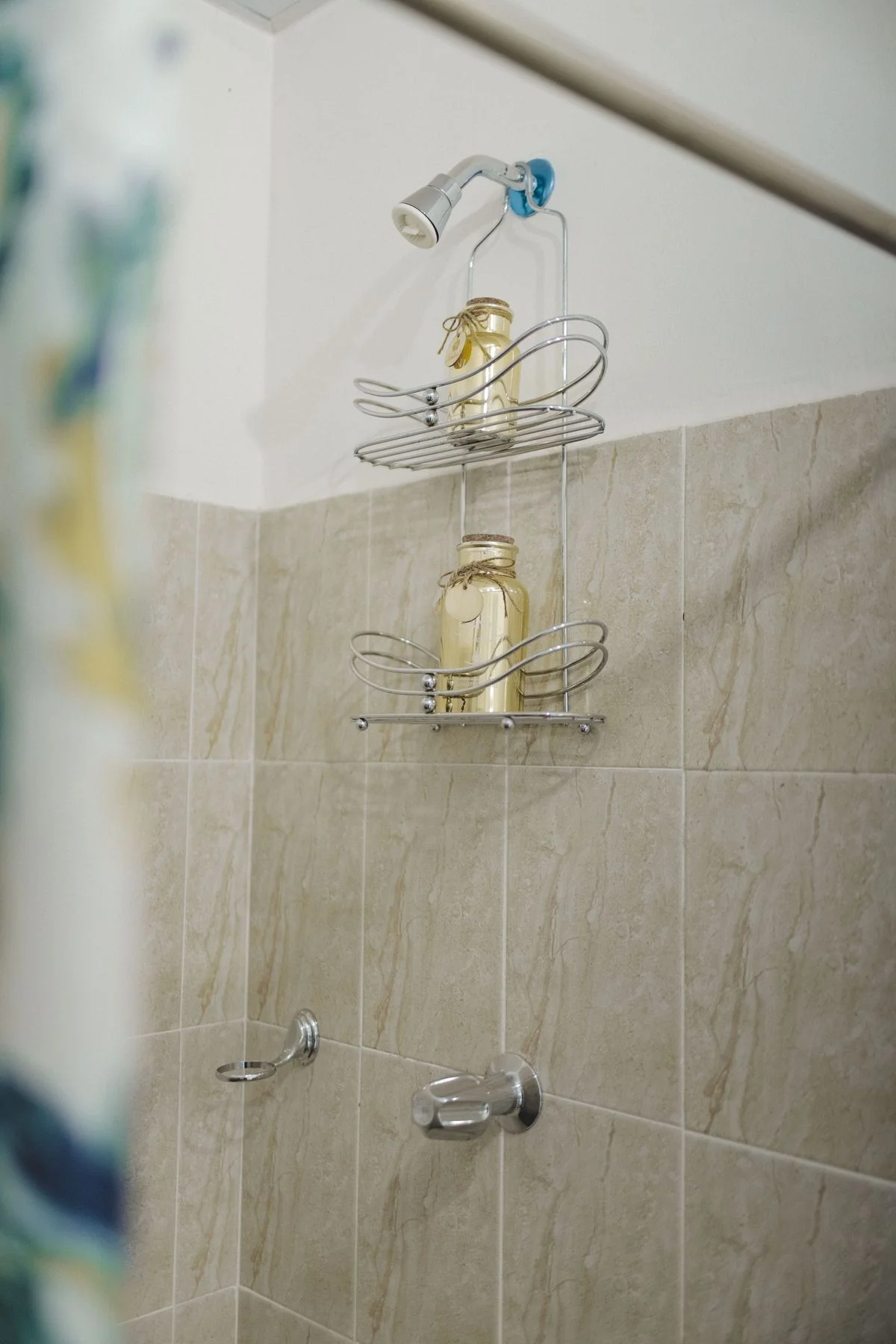 Shower caddy hanging from the showerhead pipe
