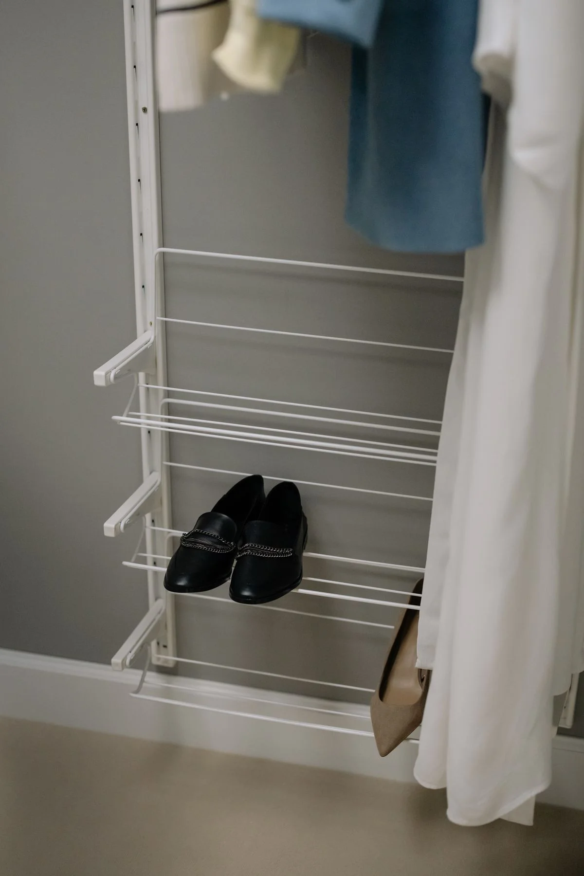 Shoe shelves and racks organizing shoes in a closet