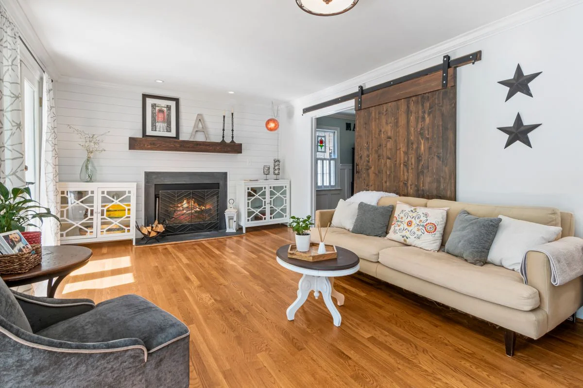 Sliding barn door in a farmhouse living room