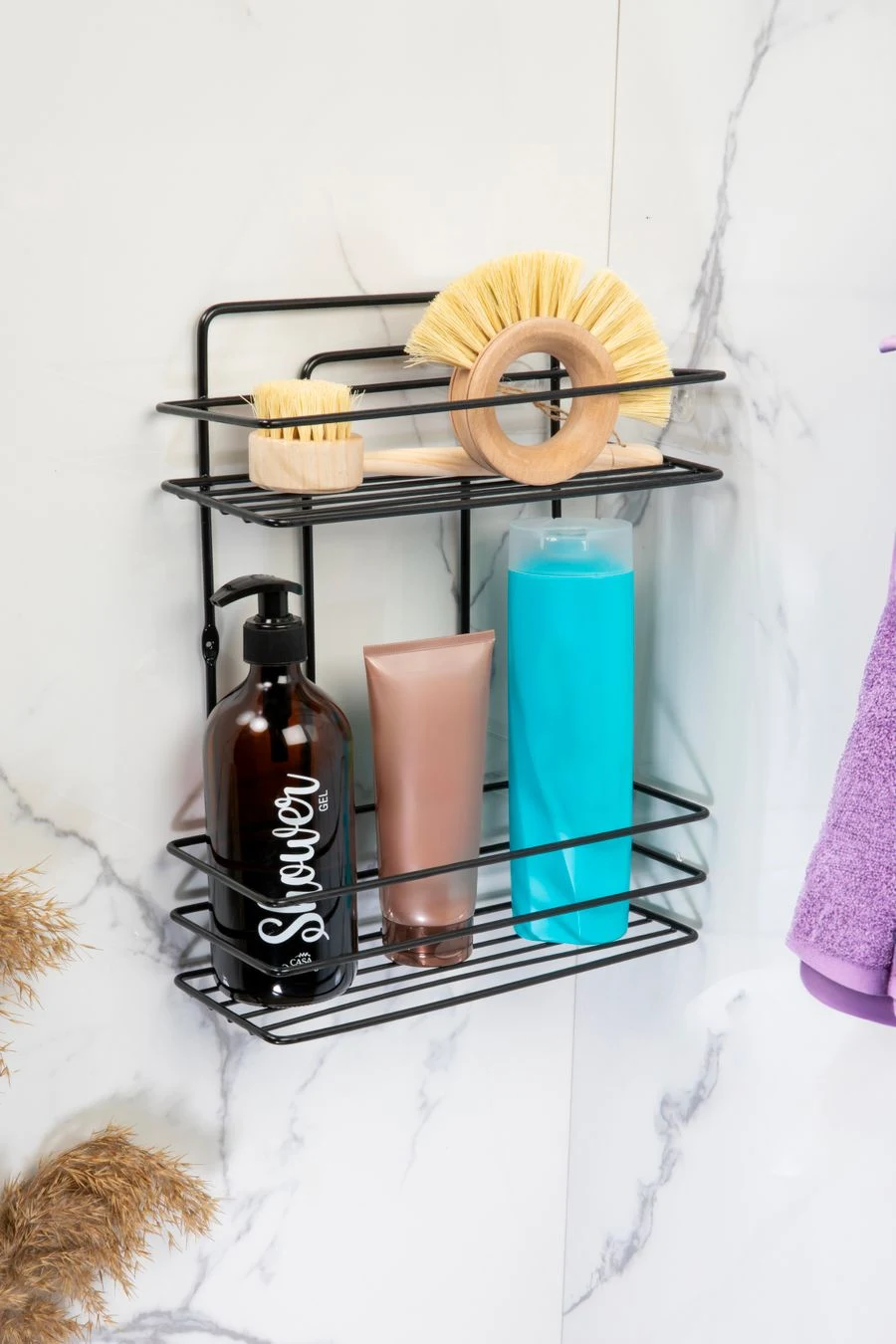Adhesive wall basket holding toiletries in a shower