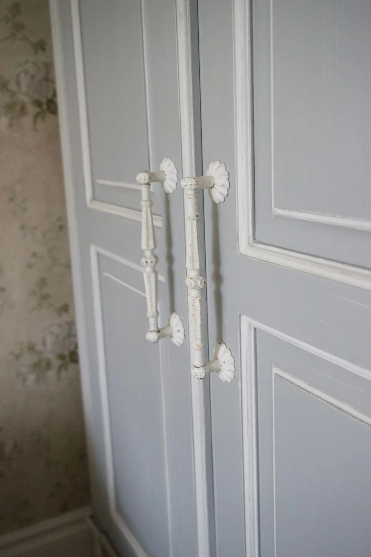 Blue painted built-in wardrobes in a bedroom