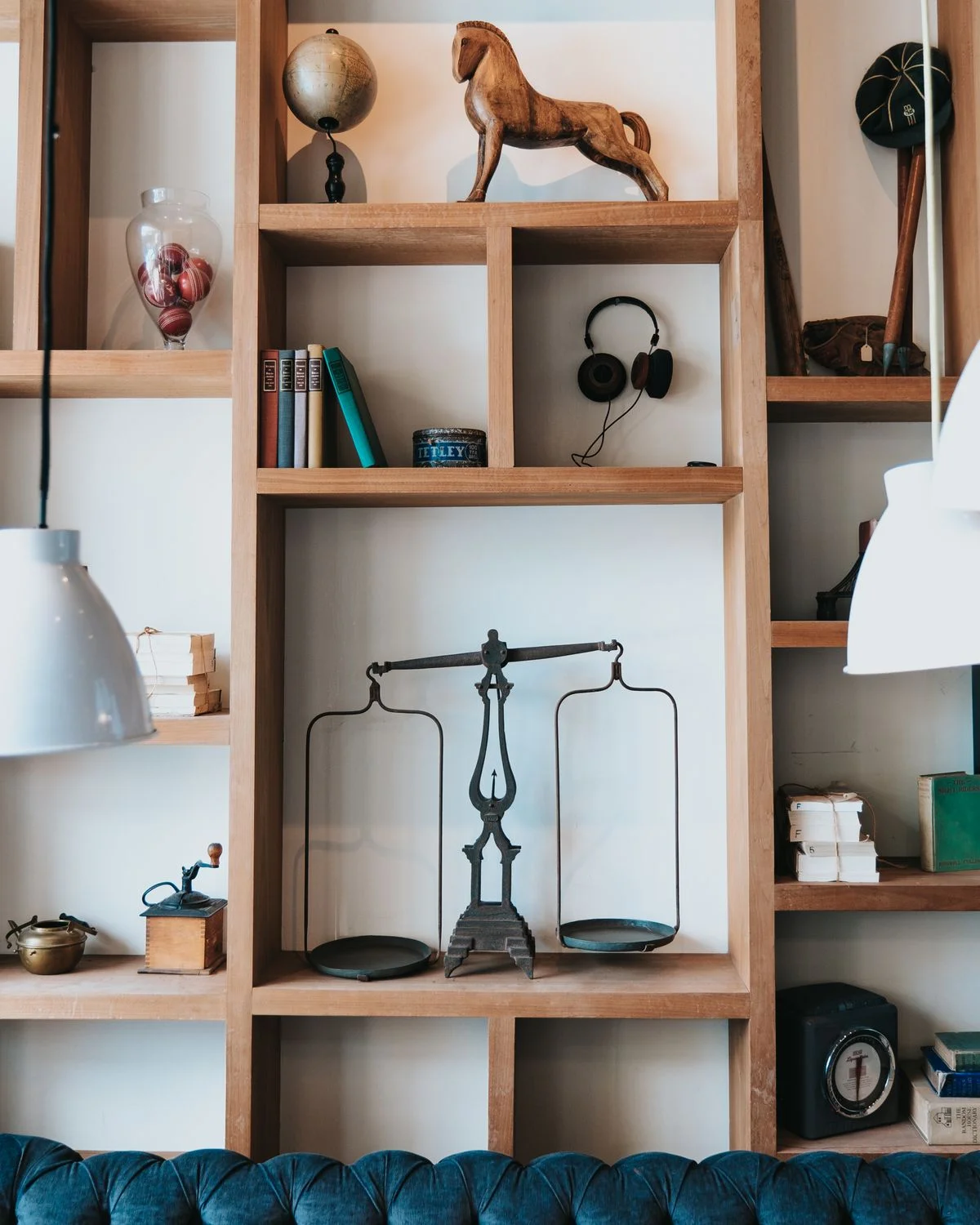 Bookshelf with varied heights of books and decor items