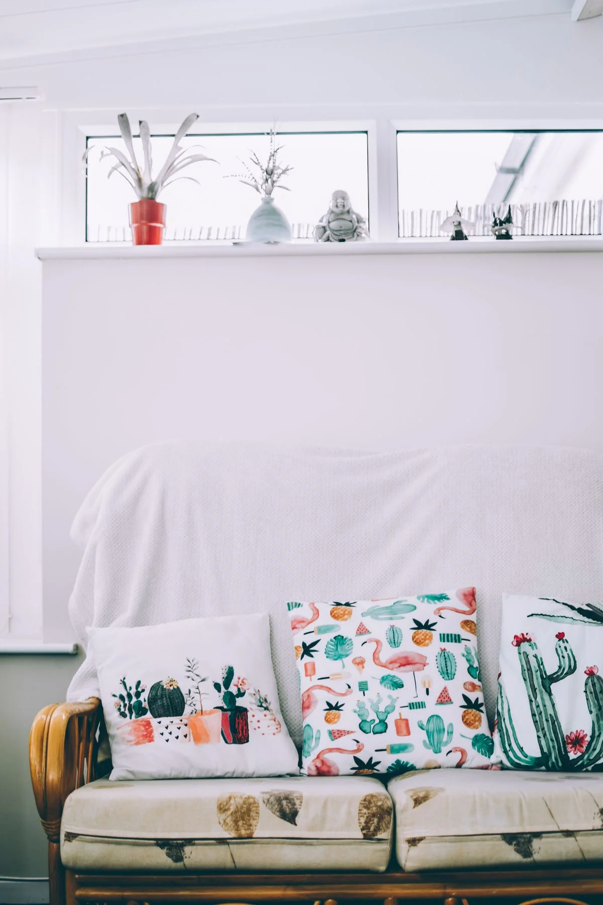 Mixed patterned throw pillows on a boho living room sofa