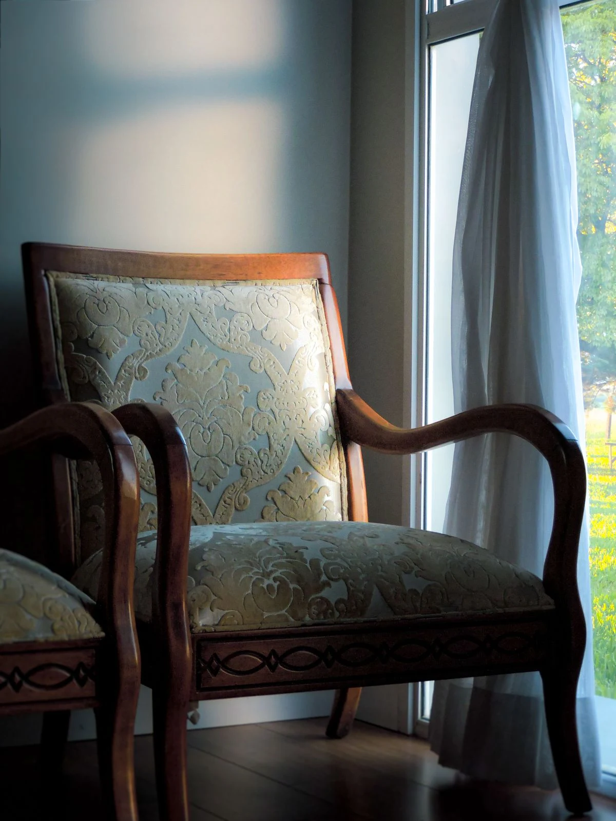 Floral upholstered chair in a traditional living room