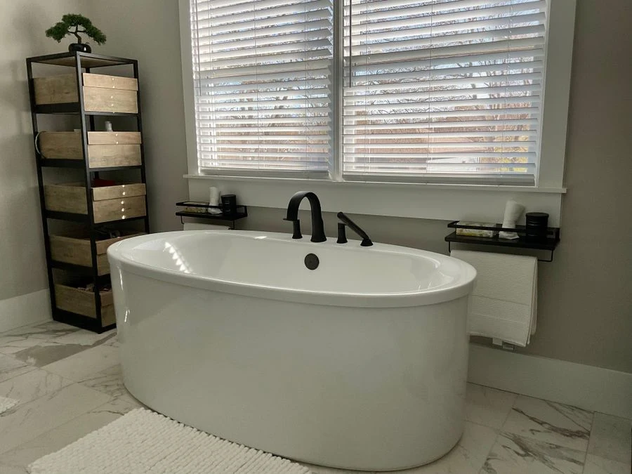 Floor-standing corner tower shelf in a bathroom beside the shower