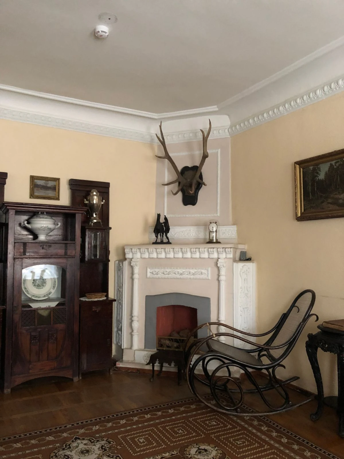 Wooden rocking chair by the fireplace in a farmhouse living room