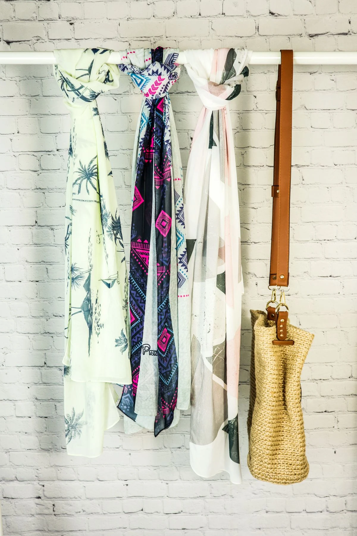 Scarf hangers organizing scarves in a closet