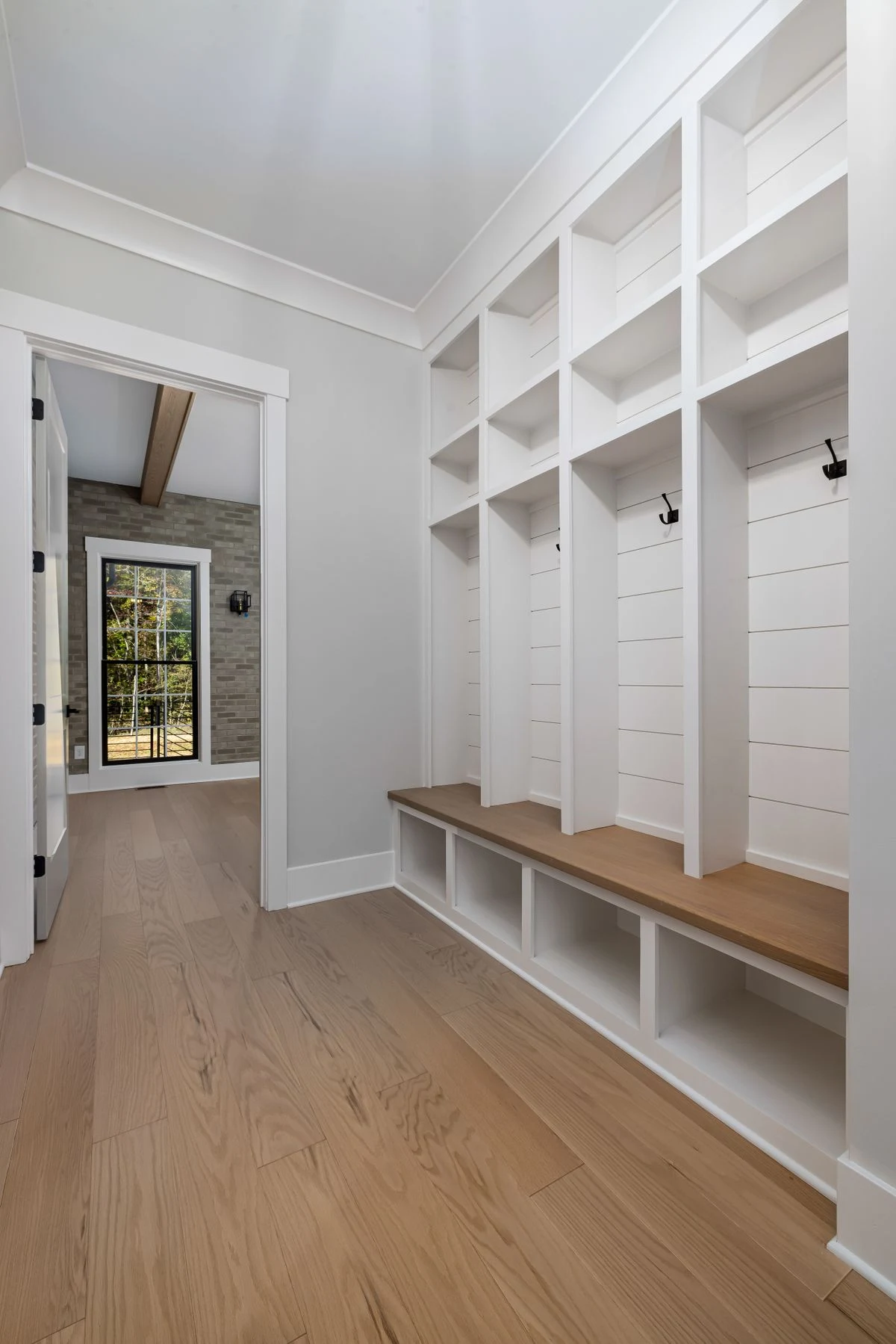 Coat closet with hooks and cubbies for jackets and bags