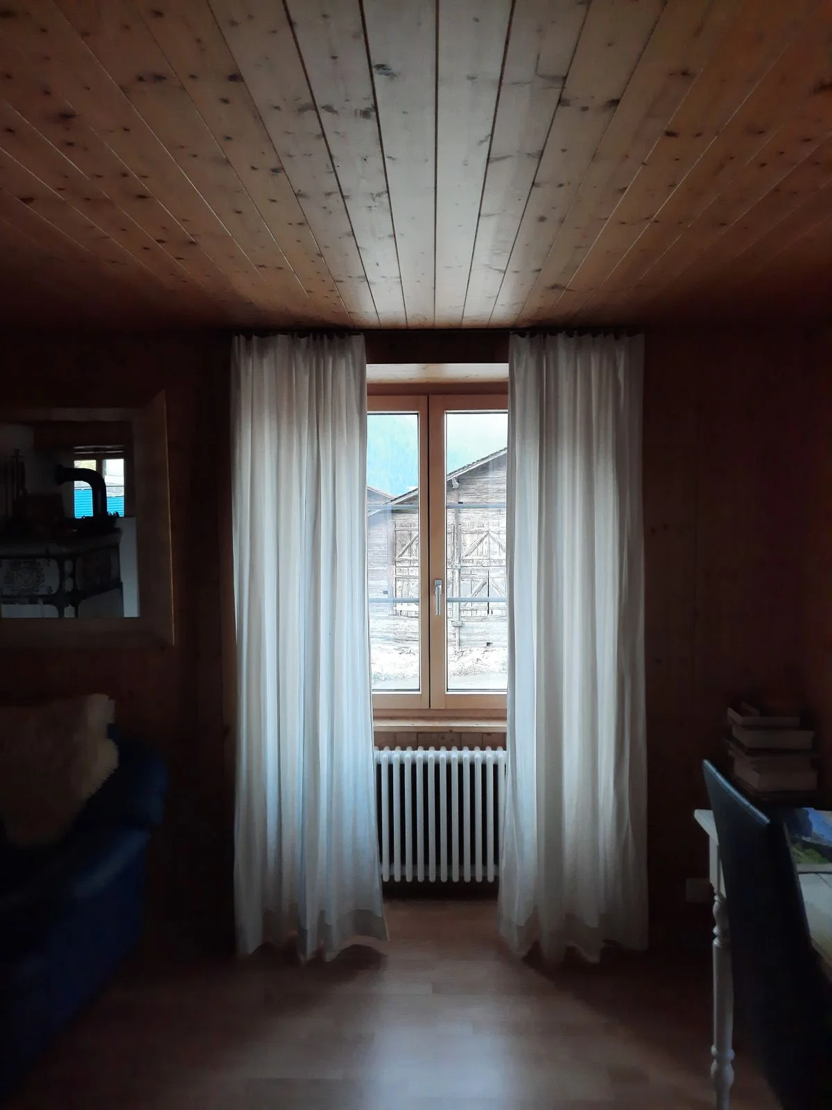 Neutral linen curtains in a farmhouse living room