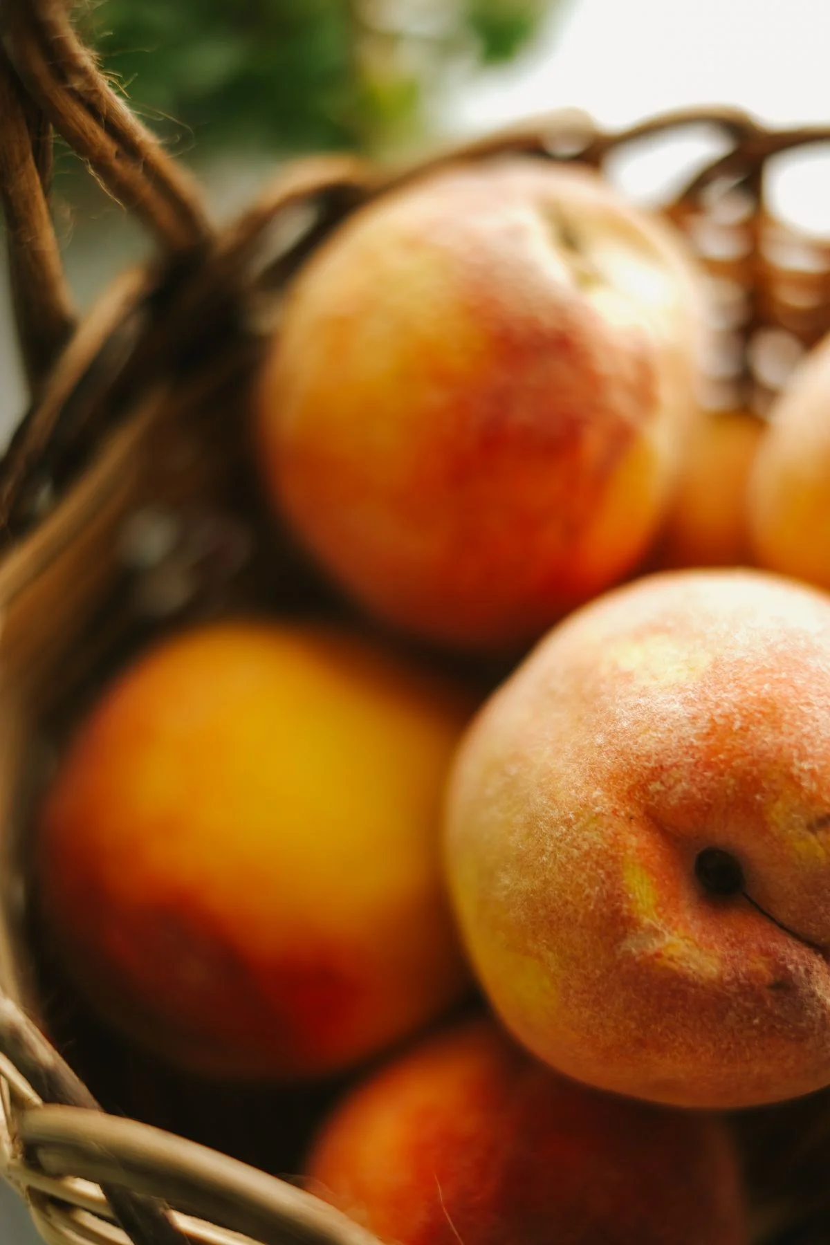 Peaches stored in a linen-lined basket