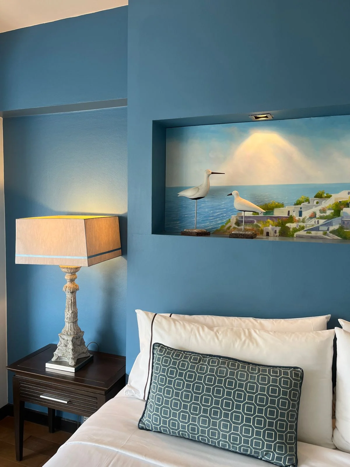 Coastal style blue and white bedroom with natural textures
