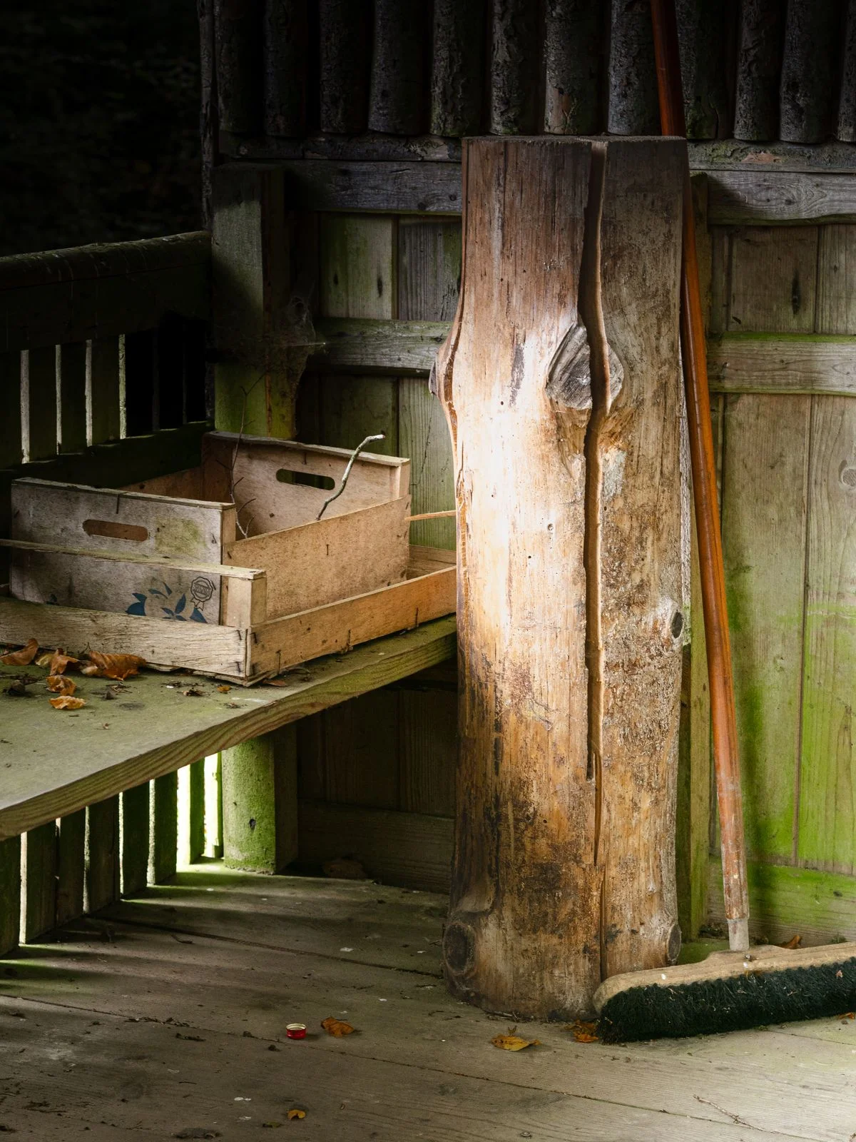 Wooden crates stacked as storage in a shed