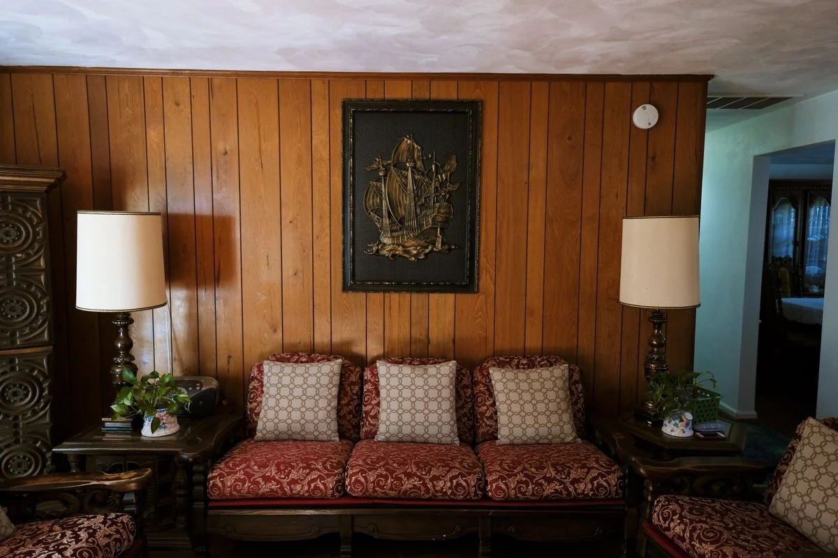 Wood paneled accent wall in a traditional living room