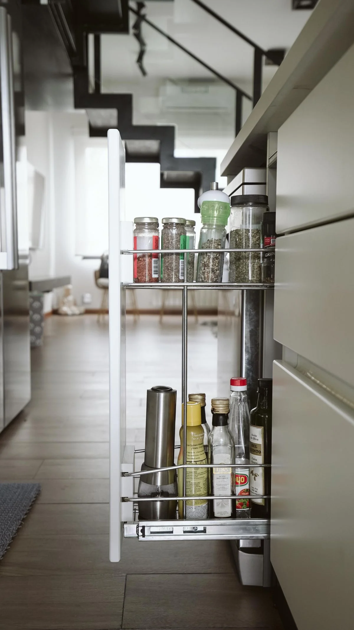Under-stair cabinets on casters that pull out for access