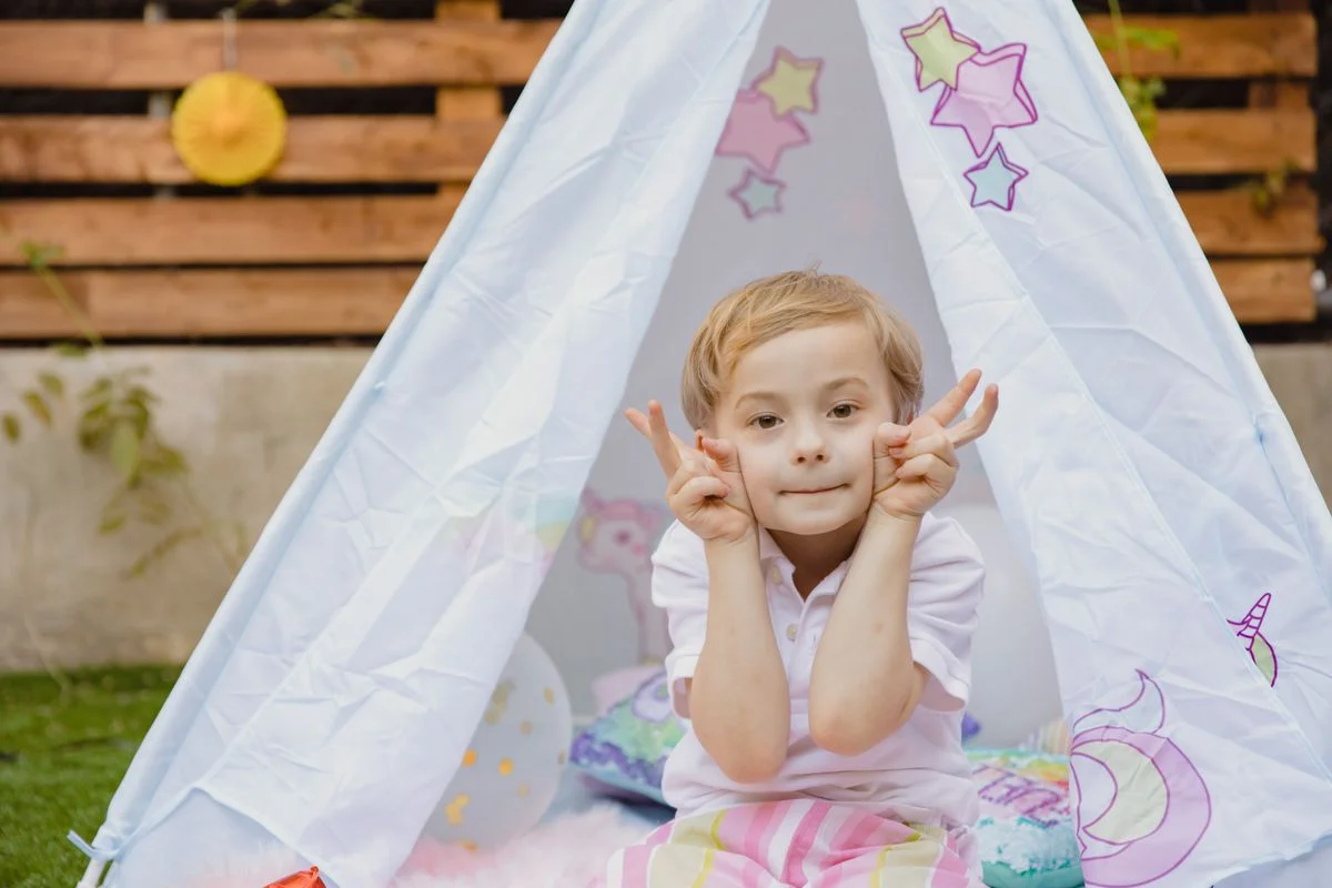 Kids garden party corner with games and decorations