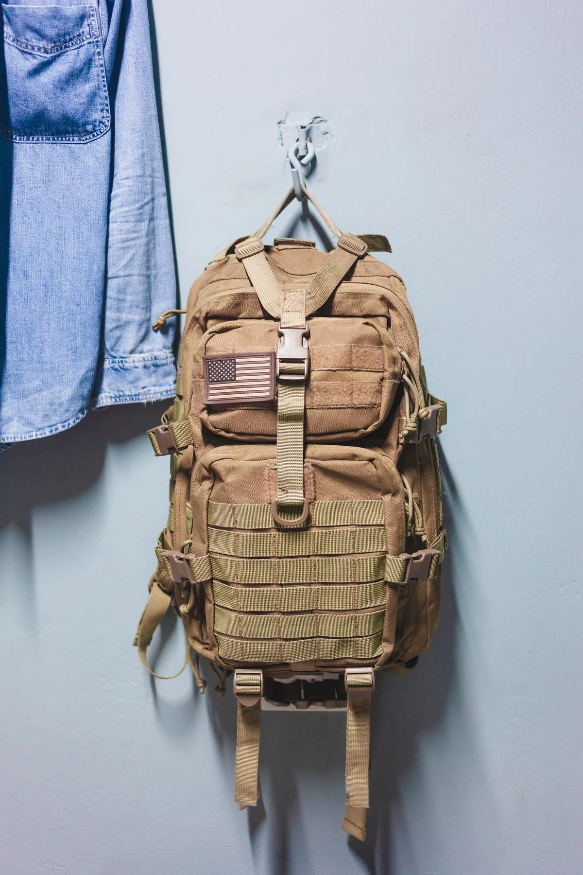 Backpack hooks on a dorm room wall