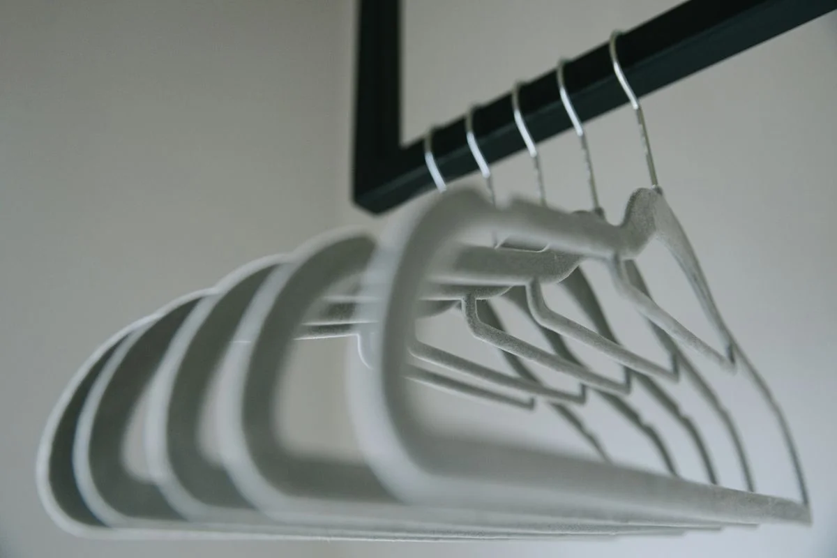 Slim velvet hangers saving space in a closet