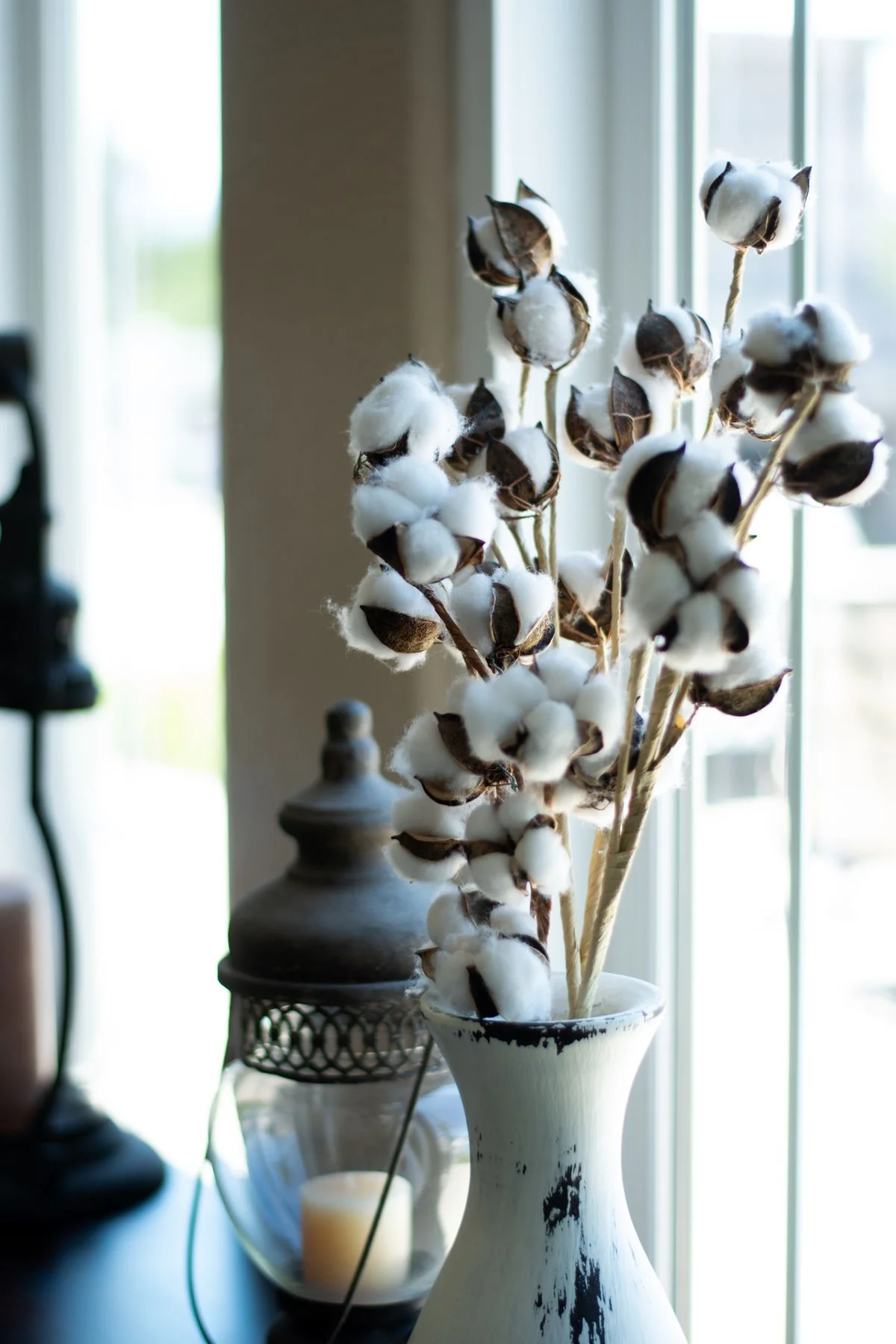 Cotton stems in a crock in a farmhouse living room