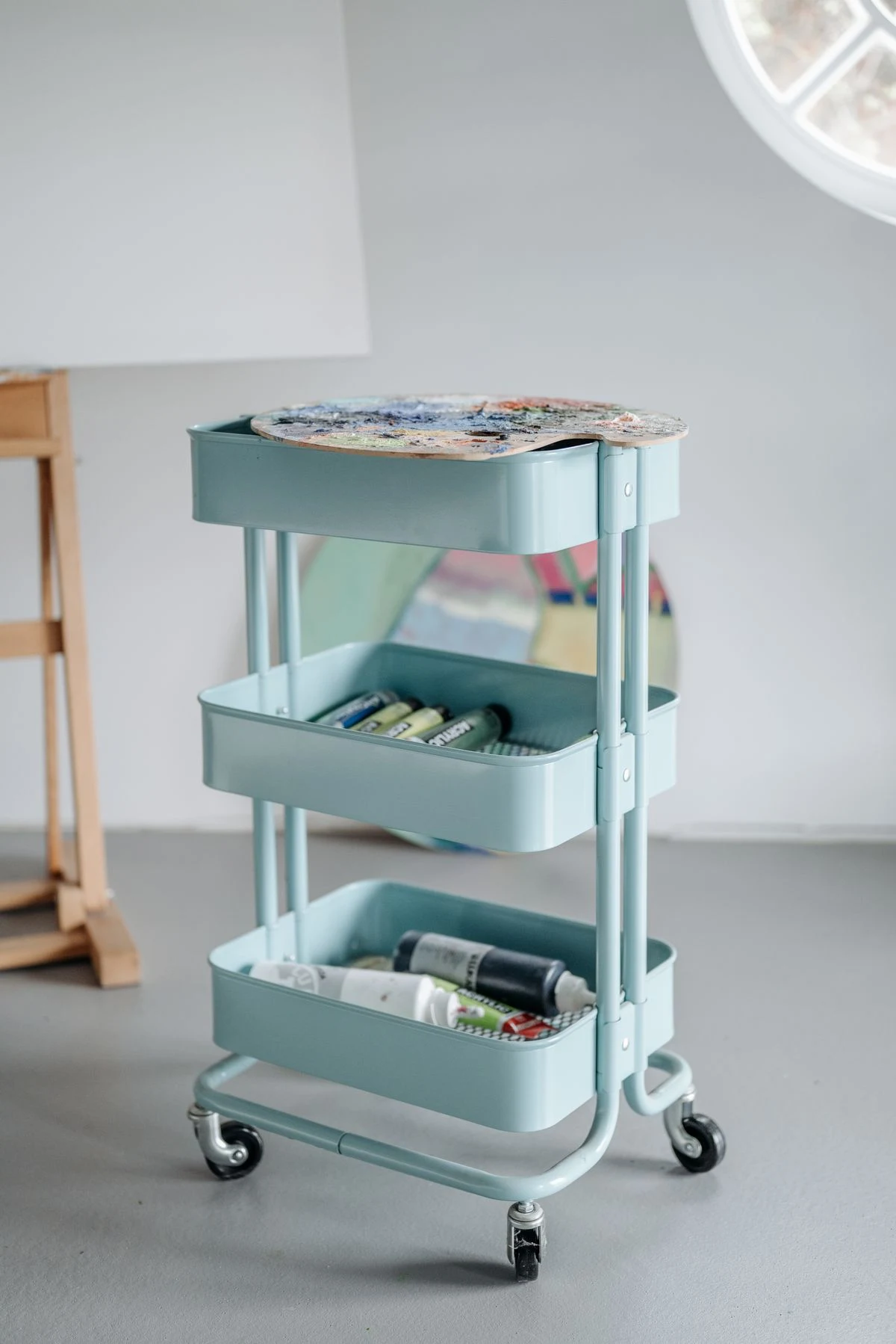Rolling cart adding extra storage to a small closet